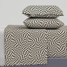 three pillows are stacked on top of each other