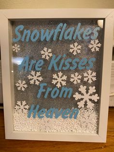 snowflakes are kisses from heaven in a frame