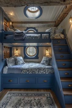 bunk beds are built into the ceiling in this bedroom with stairs leading up to the second floor