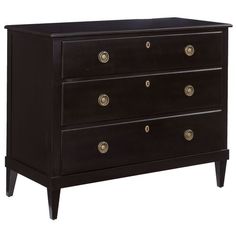 a black dresser with gold knobs on the top and bottom drawers, against a white background