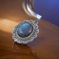 Stunning Labradorite Oval Cabochon Pendant in Sterling Silver - Handmade Jewelry with Iridescent Glow Embrace the magic of nature with our exquisite Labradorite Oval Cabochon Pendant, set in lustrous sterling silver. This handcrafted pendant features a mesmerizing labradorite stone, known for its captivating play of colors and mystical iridescence. Details: Stone: Genuine Labradorite Cabochon Shape: Oval Setting: Handcrafted Sterling Silver Dimensions: [Include dimensions of the pendant, e.g., 1 Oval Labradorite Cabochon Jewelry, Oval Labradorite Cabochon Necklace, Oval Cabochon Labradorite Jewelry, Handmade Labradorite Oval Pendant Jewelry, Silver Labradorite Oval Jewelry, Labradorite Cabochon Oval Pendant, Labradorite Cabochon Oval Pendant Jewelry, Bohemian Oval Labradorite Jewelry, Oval Silver Labradorite Jewelry