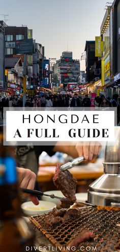 a person is grilling meat in the middle of a busy street with text overlay that reads, hongdae a full guide