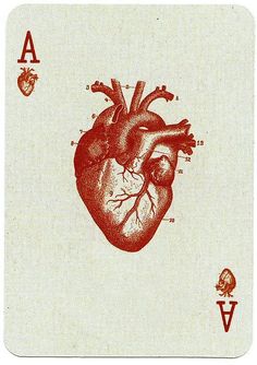 a playing card with an image of a human heart on it's back side