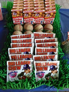 baseballs and snacks are on display in the grass