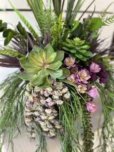 a bunch of plants that are sitting on a table