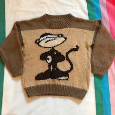 a small sweater with a monkey on it