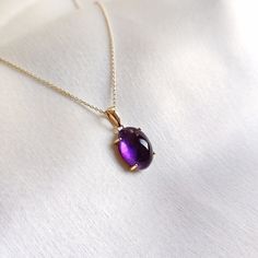 This stunning Pendant is set in 14k Solid Yellow Gold with Natural Purple Amethyst with utmost precision. It is a unique gemstone Pendant for nearly every occasion and is completely hassle-free jewelry. ITEM DETAILS: * Gem: Purple Amethyst * Gem Size: 10x14mm * Gem Shape: Oval * Gem Weight: 6.03 carats * Gold Purity: 14KT  * Gold Weight: 0.73 gram * Total Weight of the Pendant: 1.94 gram The Gold purity is guaranteed and it comes with authentic 14KT gold hallmark. Since my items are handmade, th Luxury Amethyst Oval Pendant Jewelry, Purple Amethyst Oval Pendant Jewelry, Elegant Amethyst Pendant Gemstone, Amethyst Gemstone Oval Pendant, Luxury Oval Amethyst Pendant, Handmade Jewelry Box, Amethyst Gem, Bezel Pendant, Birthstone Pendant