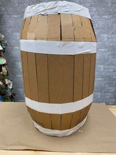 a cardboard barrel sitting on top of a table