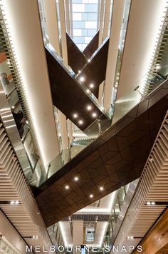 the interior of a modern building with high ceilings