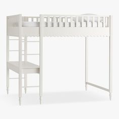 a white bunk bed with a ladder next to it and a shelf underneath the bed