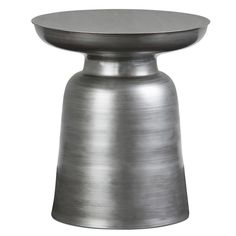 a metal table with a round top on it's side, against a white background