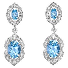 Elevate your look with our stunning aquamarine drop earrings, featuring a mesmerizing ice blue hue that radiates elegance. Enhanced with diamonds and crafted in white gold, these earrings offer a timeless allure with a touch of modern refinement. Aquamarine Drop Earrings in 18Karat White Gold with White Diamond. Aquamarine: 2.29 carat, 8X6mm size, oval shape. Aquamarine: 0.40 carat, 5X3mm size, oval shape. White Diamond: 0.15 carat, 2.00mm size, round shape, G color, VS clarity. White Diamond: 0 Luxury Elegant Blue Diamond Earrings, Luxury Blue Brilliant Cut Earrings, Luxury Blue Topaz Brilliant Cut Earrings, Luxury Aquamarine Blue Earrings, Elegant Blue Diamond-cut Earrings, Butterfly Pin, Naha, Elevate Your Look, Yellow Sapphire