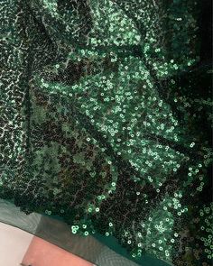 Emerald Green Sequin Fabric, Glitz Stretch Green Sequin Mesh Fabric by the yard. Mint Sequin Fabric for Wedding Decoration, Gowns, Fancy Table Runners, Curtains, Sequin Dress and more. Beautiful shiny iridescent sequins are sewn all over the mesh. Iridescent effect offers a different color from various positions, while the construction provides a flexible drape, perfect for overlaying darling skirts and dresses. Sheer and stretchy, this unique textile can be used for a large variety of projects, such as fitted dresses, gowns, formal wear, backdrops, curtain panels, elegant table runners, curtains, or any decorative endeavor. Content: Mesh, Sequins 3mm Sequins Color: Emerald Green Width: 56 inches Weigh: Approximately 11 oz per linear yard Light to Medium Weight Semi Sheer 2-Way Stretch Ple Green Sequin Fabric For Party And Festive Occasions, Green Sequin Fabric For Festive Party, Festive Green Sequin Party Dress, Festive Green Sequin Dress For Party, Green Glamorous Sequin Fabric For Party Season, Glamorous Green Sequin Fabric For Party Season, Green Sequin Fabric For Evening And Party Season, Green Sequin Fabric For Party, Green Glamorous Sequin Fabric For Festive Occasions