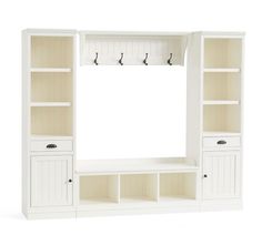 a white entertainment center with built - in shelves and hooks on the door, against a white background