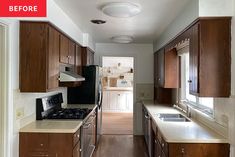 an empty galley kitchen with wood cabinets and white counter tops is seen in this image