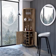 a room with a bar and stools next to a window that has trees in the background