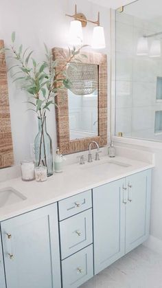 a bathroom with two sinks and a large mirror