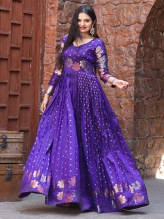 This stunning gown comes in a beautiful violet color with intricate zari weaving work, adding a touch of elegance and grace to your look.
Crafted from high-quality Banarasi silk, this fully stitched gown is available in sizes XS to XL, ensuring a perfect fit for every body type. The gown has a 4-meter flair and a length of 54 inches, offering a flowing and flattering silhouette.
Pair this violet gown with matching accessories and heels to complete your look and turn heads wherever you go.
This g Elegant Purple Anarkali Set With Zari Work, Elegant Purple Anarkali Set For Festivals, Purple Art Silk Kurta With Zari Work, Designer Banarasi Silk Gown With Zari Work, Purple Floor-length Salwar Kameez With Zari Work, Floor-length Purple Salwar Kameez With Zari Work, Purple Chanderi Dress With Zari Work, Purple Zari Work Floor-length Salwar Kameez, Designer Wear Purple Dress With Pallu