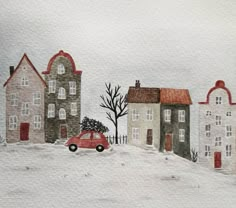 a red car driving down a snow covered road next to houses and trees in winter