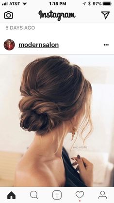 a woman with her hair in a low bun is instagraming on instagram