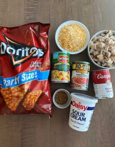 the ingredients to make an appetizer laid out on top of a wooden table