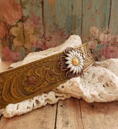 v'¯) .`*.¸.*' ❤ CONCHO COLLECTION ❤ ¸.*'.*'¨) ¸. (¸.*'(¸.*' (¸. My leather concho cuff bracelets will add a rustic feminine touch to your look! Each made from tooled leathers & beautifully detailed conchos. Filigrees and rivets add dimension. They can be dressed up or down to compliment any outfit. Buy it ---- Wear It----Make it your own! This DESIGN~ ❤ A pretty yellow and white daisy is layered over a beautiful copper flower filigree. ❤ Set on hand painted yellow tooled leather. A dark wash Bohemian Adjustable Flower Cuff Bracelet, Adjustable Bohemian Flower Cuff Bracelet, Flowers Wild, Daisy Jewelry, Daisy Bracelet, Pretty Yellow, Rustic Glam, Field Of Flowers, Yellow Daisy