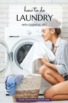 a woman sitting on the floor next to a washer and dryer with text overlay that reads how to do laundry with essential oils