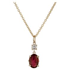 Oval ruby diamond pendant necklace. GIA certified natural simple heat only oval ruby set in a scroll basket 14k yellow gold setting, with one round full cut accent diamond. 16 inch 14k yellow gold chain. Designed and crafted in the Peter Suchy workshop. 1 oval red ruby, approx. 1.20cts GIA Certificate # 5211309649 1 round full cut diamond, G-H VS approx. .12cts 14k yellow gold Stamped: 14k 585 2.6 grams Top to bottom: 17.8mm or .7 Inch Width: 6.1mm or .24 Inch Depth or thickness: 4.54mm Chain: 16 Inches Width: 1.3mm Ruby Diamond Pendant, Ruby Jewelry Necklaces, Jewelry Necklace Simple, Antique Wedding Bands, Ruby Set, Diamond Sapphire Engagement Ring, Antique Engagement Rings Vintage, Antique Bracelets, Vintage Sapphire