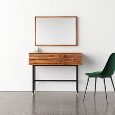 a green chair sitting next to a wooden dresser with a mirror on top of it