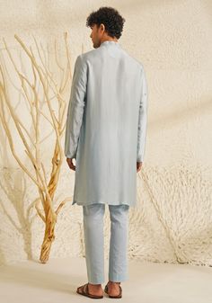 Featuring a stylish Powder Blue Chanderi Silk Kurta Set, complemented by metallic silver buttons that add a touch of grace. Teamed with matching pants for an elegant look, this ensemble is perfect for an engagement, Roka or Sangeet, blending sophistication with contemporary charm. Composition : Chanderi Silk Care: Dry Clean Only and Vacuum Storage This product can be customized for sleeves, length and colour Delivery : 4-6 weeks as the product is hand crafted. Check Size Guide or choose MySize for free customisation (All Sizes above XL can be made at 15% additional cost) For more information and sizes please contact fabiliciousfashion@gmail.com or visit our Copenhagen studio. About the Designer : Shreyansh, a distinguished designer label specializing in luxurious ethnic menswear for weddin