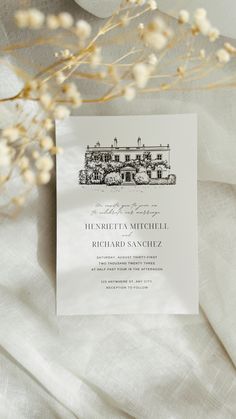 the wedding stationery is printed on top of white linen