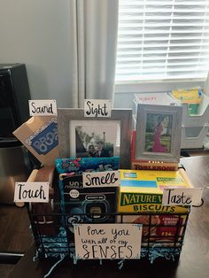 a basket filled with cards and pictures on top of a table