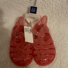 New! Little Girls Pink Sparkle Jelly Buckle Sandals. Size 10. Cute Open Toe Jelly Sandals, Playful Plastic Sandals For Spring, Cute Red Sandals For Summer, Playful Red Open Toe Sandals, Cute Non-slip Sandals For Party, Cute Red Sandals For The Beach, Cute Red Beach Sandals, Gap Sandals With Round Toe For Spring, Casual Gap Sandals For The Beach