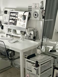 a white desk topped with a computer monitor and keyboard