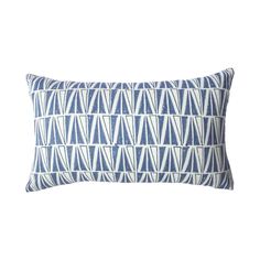 a blue and white pillow on a white background