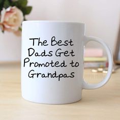 a white coffee mug with the words'the best moms get promote to grandmas '