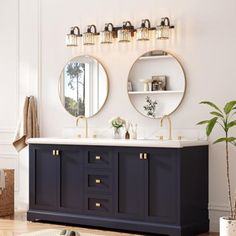 a bathroom with two round mirrors above the sink and blue cabinets on either side of the vanity