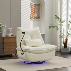 a white chair sitting on top of a rug in a living room