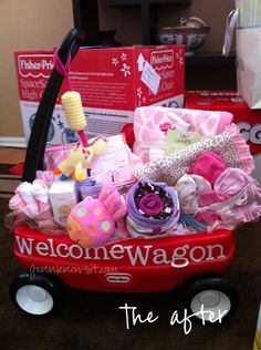 a red wagon filled with lots of baby items