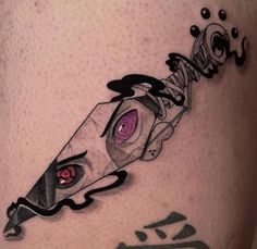 an artistic tattoo on the leg of a man with a knife in it's center