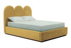 an upholstered bed with blue sheets and pillows on the headboard is shown in front of a white background