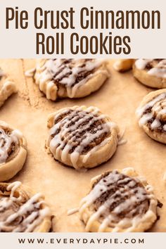 homemade cinnamon roll cookies with icing on parchment paper and title overlay reads, pie crust cinnamon roll cookies