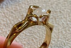 Pretty gold-plated character ring from the Charles Jourdan brand. 2 characters hugging a crystal ball. Size: 51EUR / 16.3mm In very good vintage condition. Gold Moonstone Ring Collectible, Characters Hugging, Vintage Bangle Bracelets, Charles Jourdan, Pretty Ring, Vintage Bangles, Hand Ring, Pretty Rings, Onyx Stone