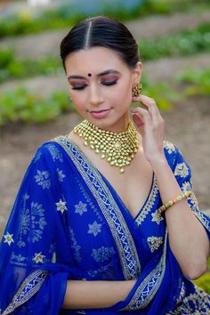 (1) Royal Blue Wedding Lehenga Choli - Indian Bridal Wear | BAnu – bAnuDesigns Gold V-neck Sets For Festive Occasions, Gold V-neck Festive Sets, Festive Blue Kundan Sets, Traditional Gold V-neck Choli, Blue Kundan Sets With Mirror Work, Blue Bollywood Kundan Jewelry Sets, Traditional V-neck Lehenga For Diwali, Blue Kundan Anarkali Set For Festivals, Traditional V-neck Lehenga For Festive Occasions