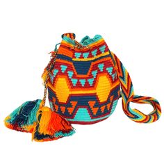 Colorful & unique crochet bag! Very lightweight, durable and comfortable to carry on. Wear it as a cross-body or shoulder bag. This stunning boho style bag is perfect for a casual day, as a beach/pool accessory or as a complement to your sports outfit. Details: Medium Size Bucket Bag Style Desert Sunset Colors (Yellow, Orange, Navy, Burgundy) Traditional indigenous symbology pattern. Matching hand-woven strap with zig-zag pattern Drawstring closure with tassels Material: Made from cotton threads