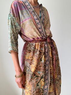 "This is one of a kind patchwork, upcycled silky robe Made free size with wrap tie closing and wide kimono sleeves  Easy and fun to wear around the house or outside as a urban boho style,  flowy kardigan with jeans and tshirt  It is very comfy and feels soft and light  the material is colourful indian saree silk made into this unique stylish over all MEAESURE free size length 40\" MATERIAL *polyester *no lining More at  https://www.etsy.com/shop/AltheaStores? CARE INSTRUCTIONS  * Wash in warm wa Urban Boho, Boho Robes, Duster Kimono, Silky Robe, House Coat, Boho Cardigan, Saree Silk, Kimono Sleeves, Indian Saree