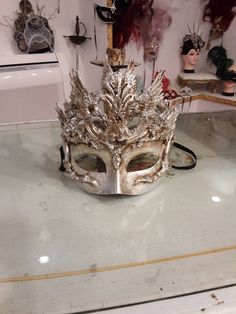 Papier-mâché mask made entirely by hand in our Atelier in Venice. Product in papier-mâché, silver leaf base and embellished with baroque decorations to make your disguise unique in its kind. Each product made is a unique piece so those who buy one of our exclusive creations will never find a copy the same as the materials used end up but above all we like to give a touch of exclusivity and originality to those who will have the pleasure of wearing a Sogno Veneziano Atelier product.