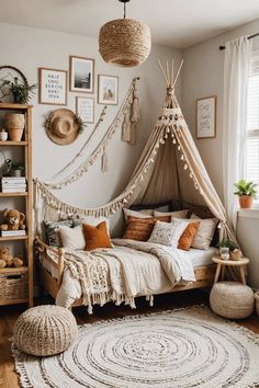 a bedroom with a canopy bed, rugs and pictures on the wall above it