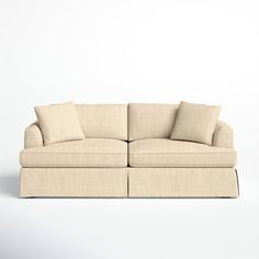 an image of a couch with pillows on the top and bottom part, in front of a white background