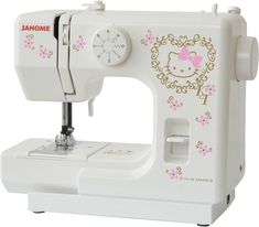 a white sewing machine with hello kitty decals on it's front and side